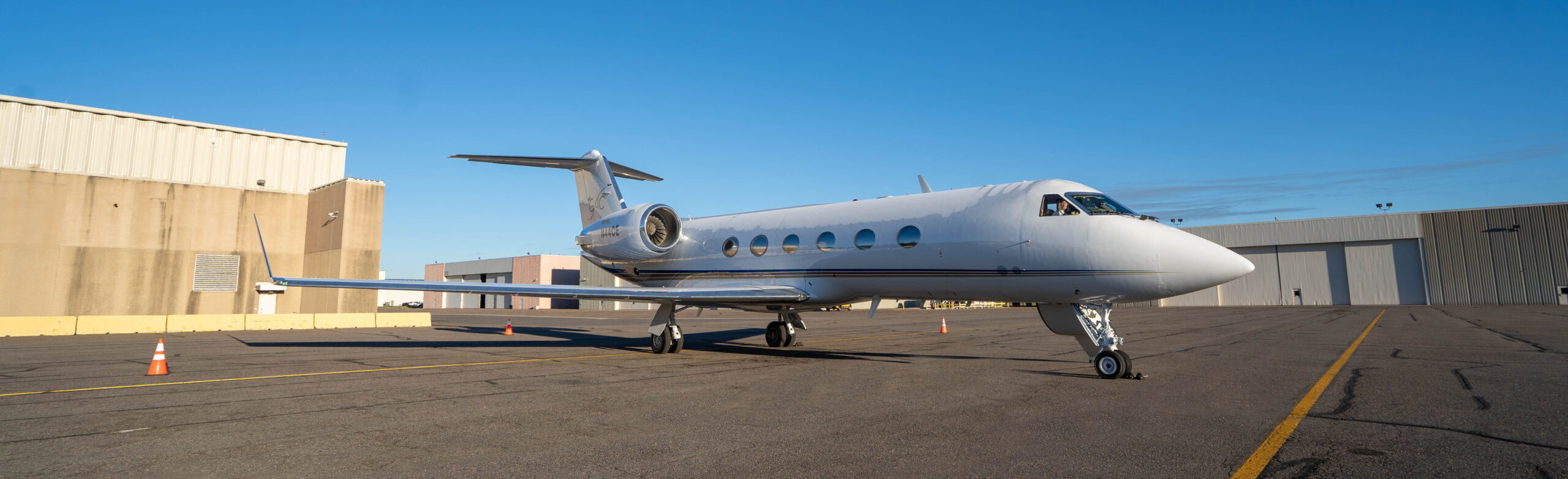 how to buy a private jet - image of plane outside hangar on tarmac