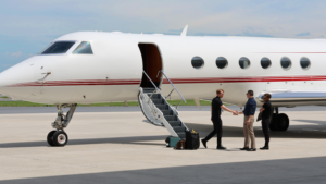 Business men greeting pilot of private jet