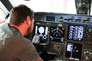 Avionics technician working on jet