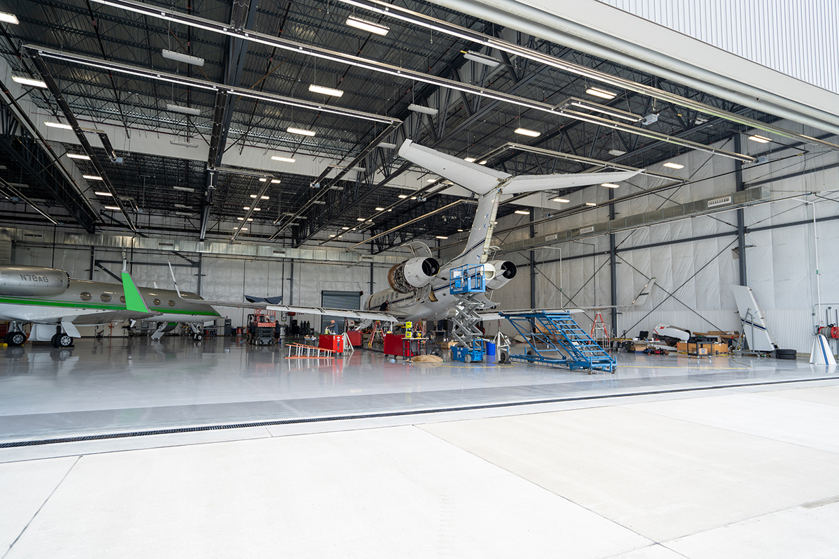 private jet airframe receiving aircraft maintenance cycle work in hangar