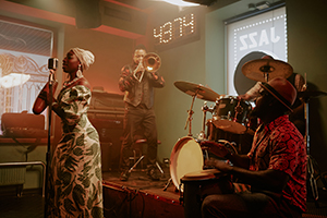 Group of musicians performing in jazz band on stage in New Orleans bar