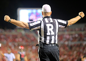 Referee making call at college football bowl game