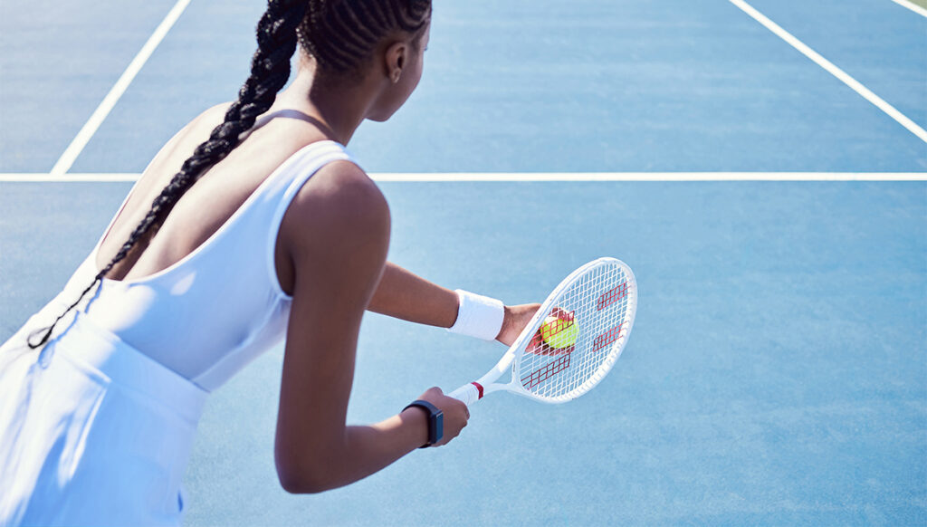 Shot of an attractive young woman playing tennis outside