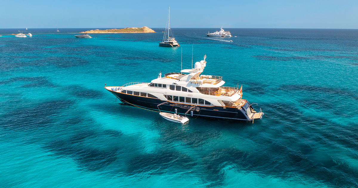 aerial view of luxury yacht on blue sea during sunny day