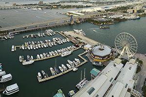 Expensive yachts and motorboats docked in Biscayne Bay harbor in downtown district of Miami, Florida.