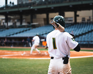 Baseball players practicing on field