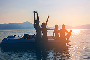 happy company of friends enjoying spring break on havasu lake