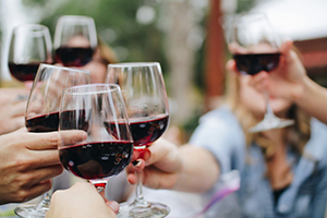 friends enjoying spring break in an Edna Valley vineyard wine tasting