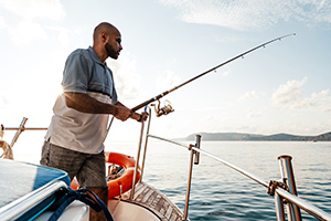 Young african american man deep sea fishing in the Caribbean 